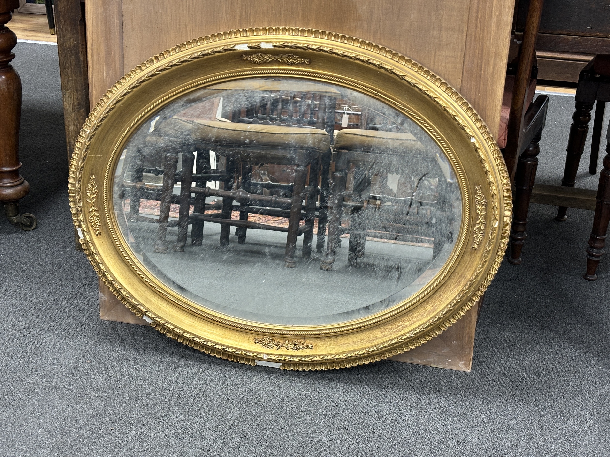 A Victorian style oval gilt framed wall mirror, width 86cm, height 68cm